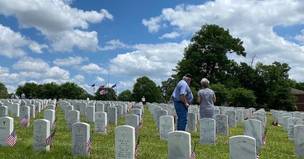 A couple visits a loved one's grave at Kentucky Veterans Cemetery-West on Memorial Day, May 30, 2022. (Photo by Jennifer P. Brown)